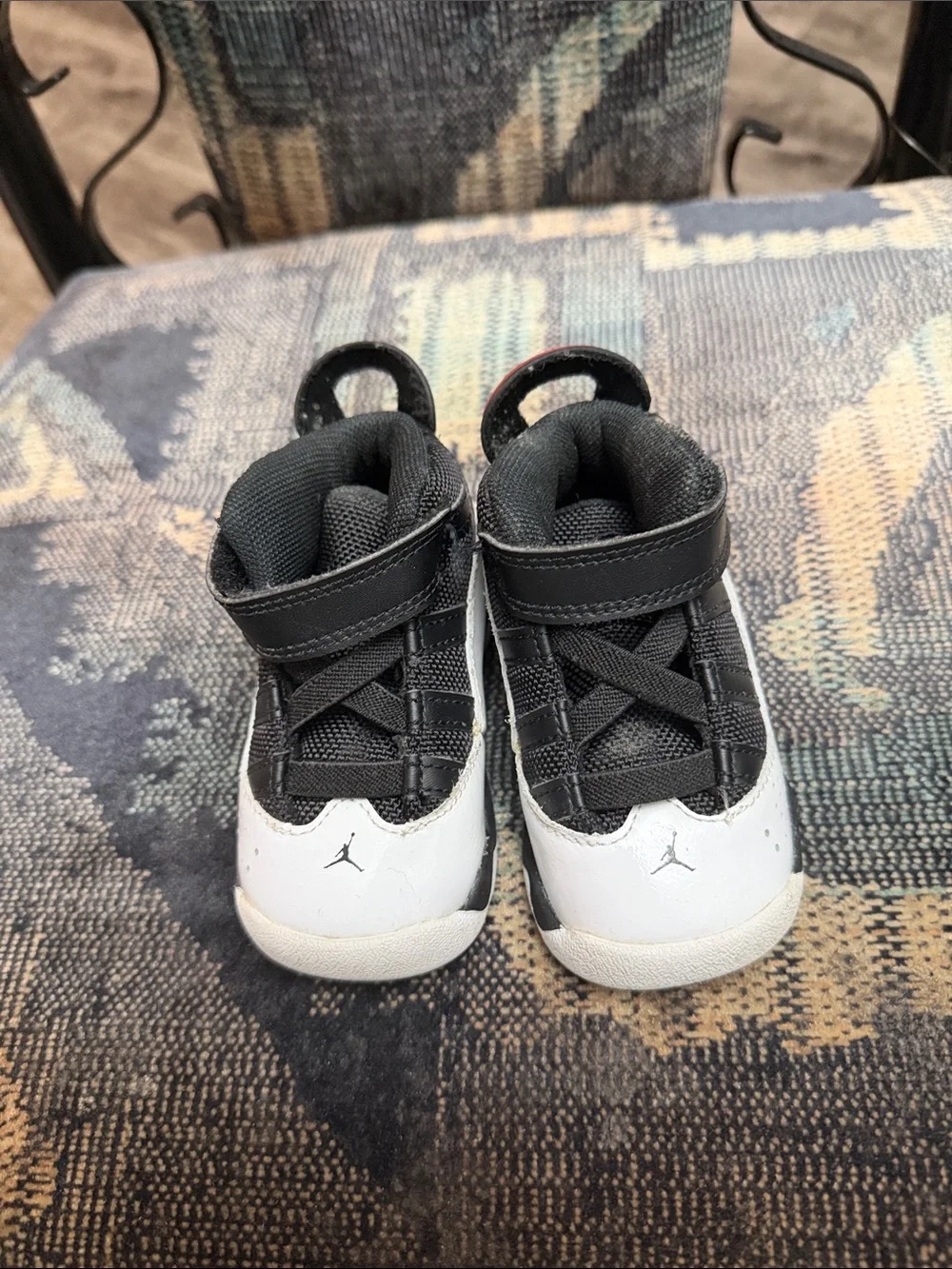 Jordan Kids Black and White High-Top Sneakers with Red Accent